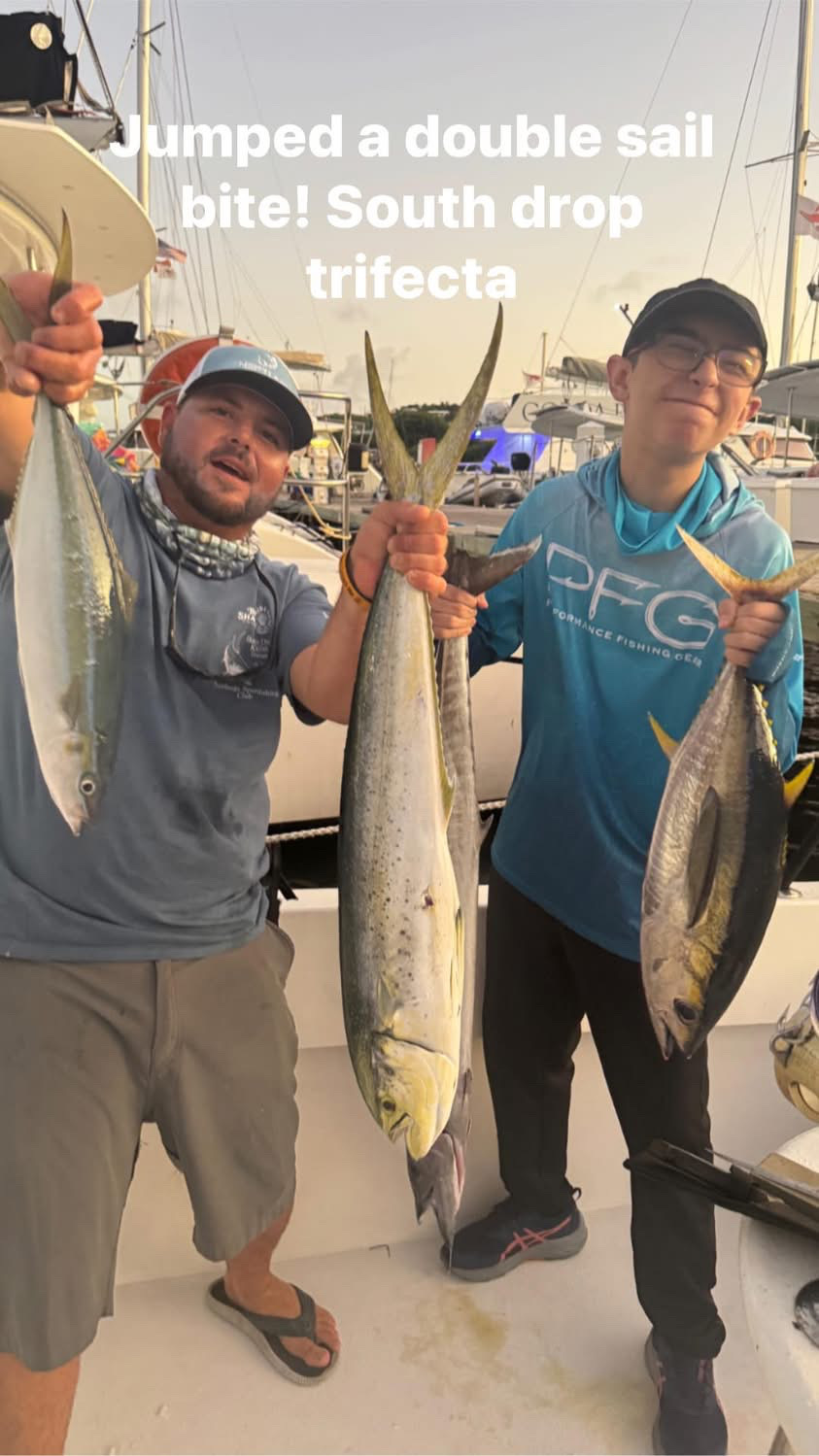 Father and son with a yellowfin and mahi