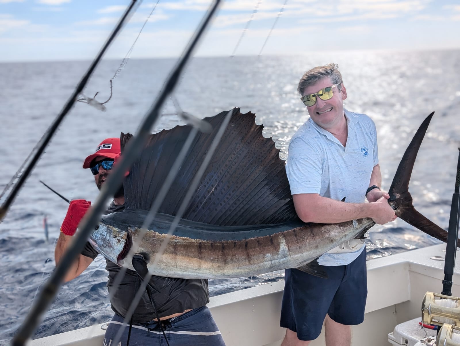 Angler and Captain Carlos with a sailfish