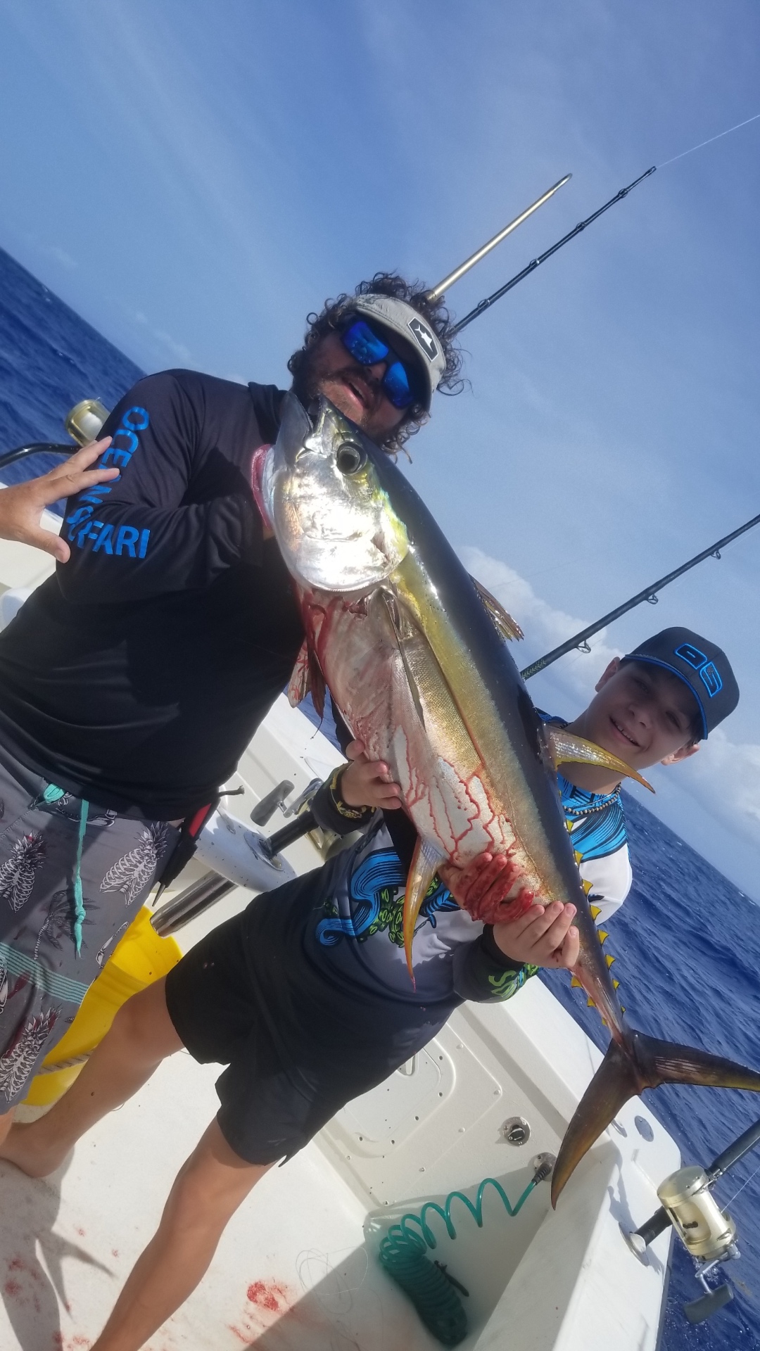Junior angler with a yellowfin tuna aboard Top Shot